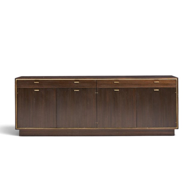 Harvey Probber Mid Century Mahogany and Brass Credenza This credenza measures: 71.25 wide x 18 deep x 25.5 inches high...