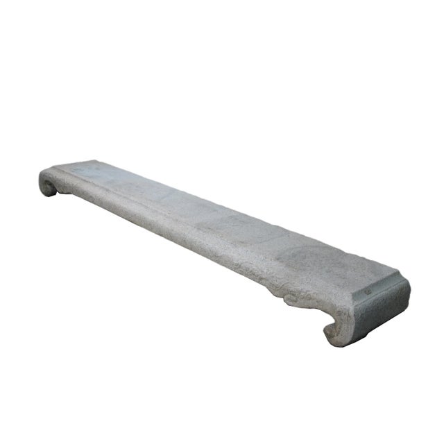 This antique low garden bench was hand carved from one piece of the stone and then chiseled by the locals from the...