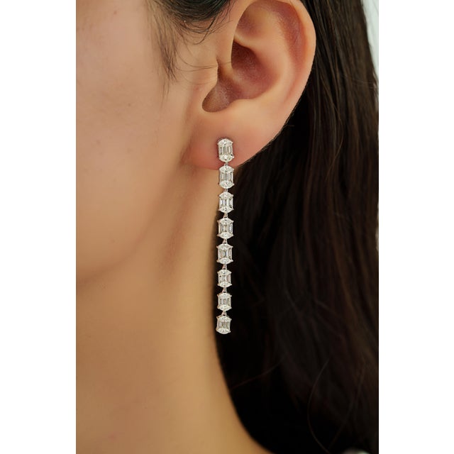These elegant linear drop earrings feature 2.84 carats of sparkling mixed-cut diamonds set in 14K white gold. All diamonds...