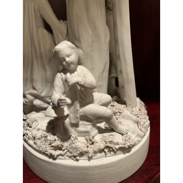This porcelain group is unglazed , “biscuit “ porcelain from the late 18th Century by Derby, It is a whimsical family...