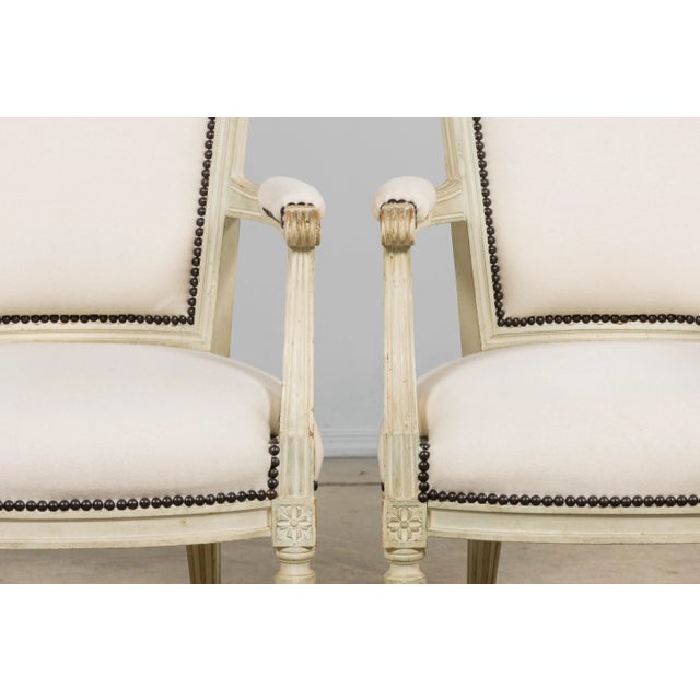 A beautiful pair of late 19th century French Louis XVI style armchairs, sourced in Provence. Handcrafted from solid...