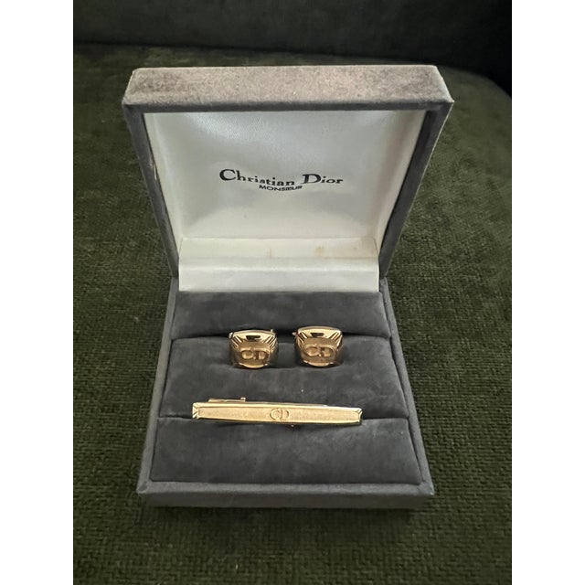 Rare Vintage Christian Dior Gold Plate Cufflinks Circa 1990 In Original Case Featuring a front Dior logo, a textured...