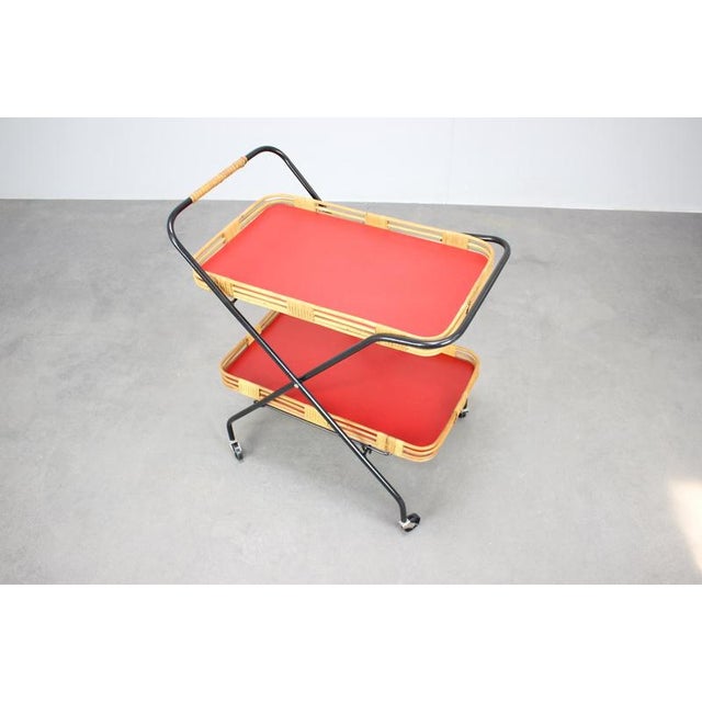 Elegant folding serving trolley produced in Czechoslovakia during the 1960s. This refined Mid-Century Modern design...