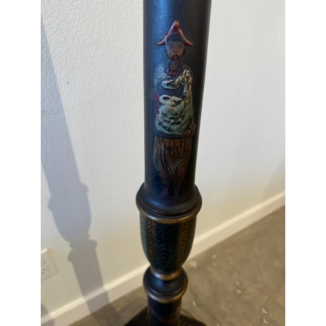 Adorned with intricate chinoiserie painted motifs on both its glass shade and body, this stunning antique floor lamp...