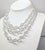 1950s rhodium plated 3-strand cut glass breaded necklace with round box clasp with single round clear rhinestone in the...