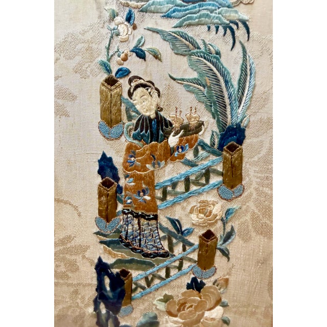 This elegant pair of Chinese panels features richly embroidered and embossed silk, showcasing refined craftsmanship and...