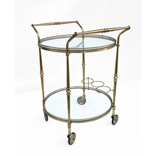 Round Brass Bar Trolley with Bottle Holder by Maison Baguès, 1950s, in Very Good conditions. Designed 1950 to 1959
