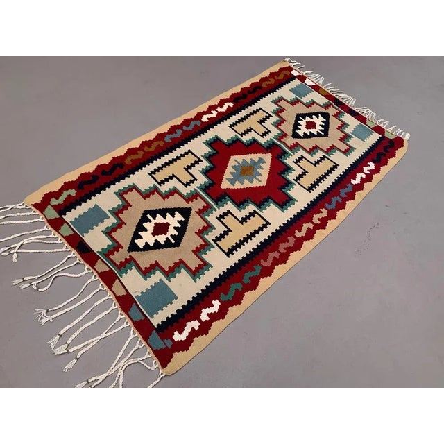 Vintage Kilim Rug, This is a lovely kilim rug from 1970s with blues and reds with a central repeating diamond pattern...