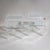 Pair of side tables in clear acrylic glass with glass shelves and square form. The tables retain the Fabianart...