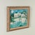 Striking oil painting on canvas depicting a sun bleached white wall and houses against a tropical bright blue sunny day....