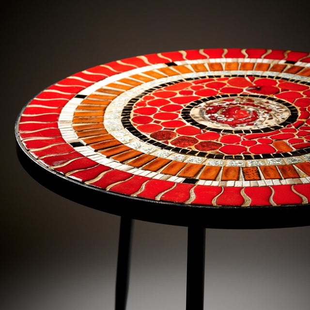 Side table from Vallauris in the South of France where numerous artists including tried tile works in all form and shape....