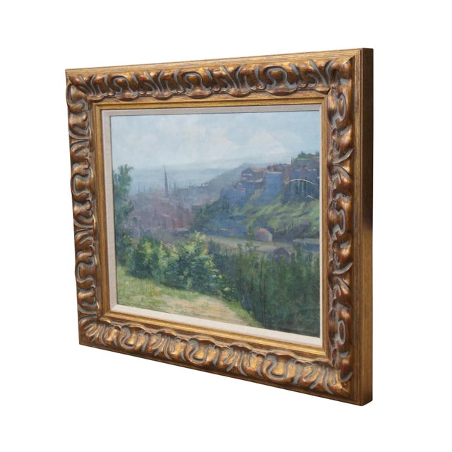 Vintage oil painting on canvas depicting a softly hued European city nestled in a lush hilly landscape off the coast....