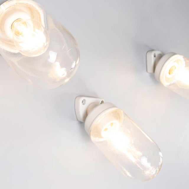 1950’s new old stock ceramic and glass angled wall lamps – long. Good practical fully original industrial wall lamps. The...