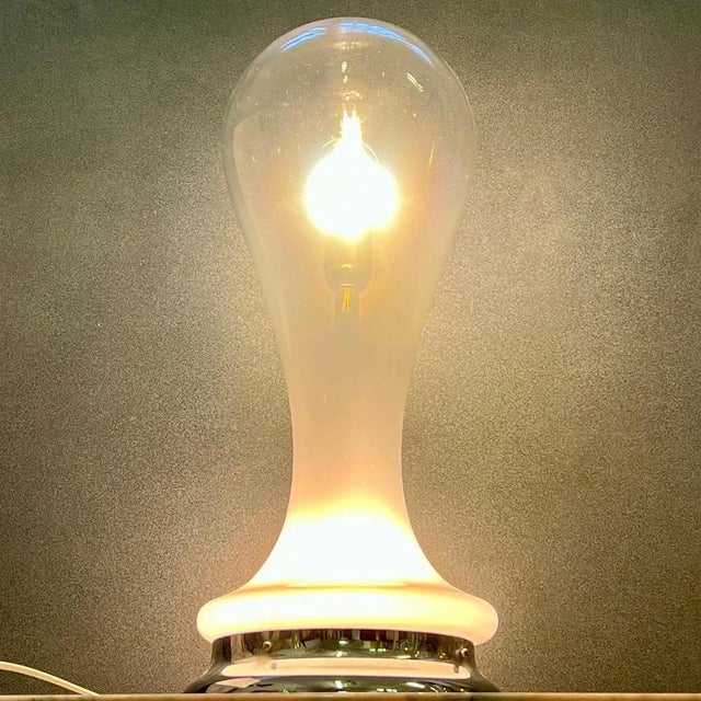 Gorgeous table lamp in blown lattimo glass from the historic A.V. glassworks. Mazzega, made in the 1970s. This fascinating...