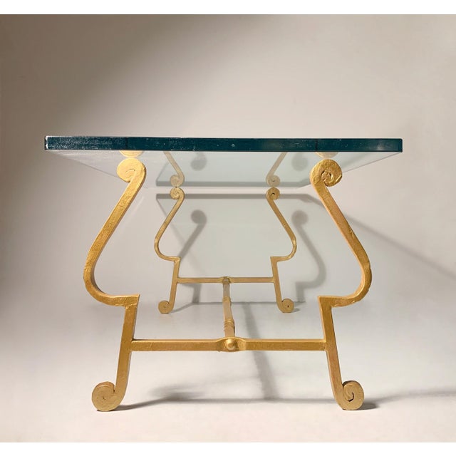A nice vintage coffee table made in Spain. Dates to the mid-century. Nice coil work with hammered design. In the manner of...