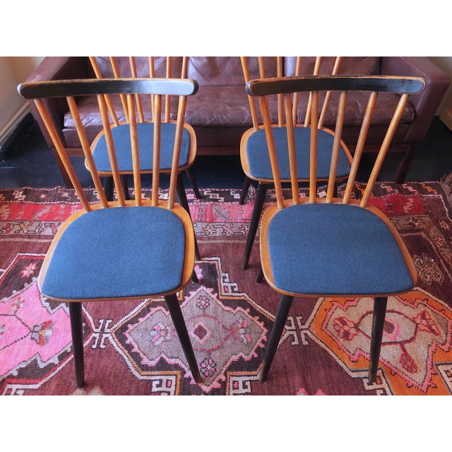Very attractive set of 4 dining chairs from the 1950s with splayed legs, partially ebonized wood, the seats recently re-...