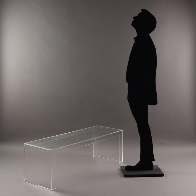 Transparent plastic coffee table with a linear and minimal shape from the 'Invisibili' collection; suitable for both...
