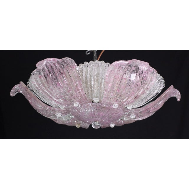 Elegant vintage Murano ceiling light with pink glass leaves from a historic Neapolitan pizzeria. Period: circa 1970. The...