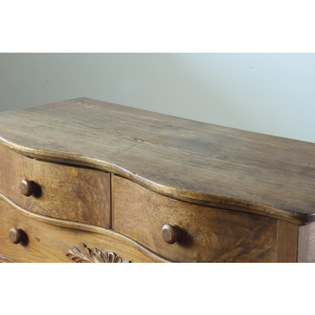 This mid-19th century buffet in oak and pinewood carries a quiet presence shaped by simple lines and hand-carved detail....