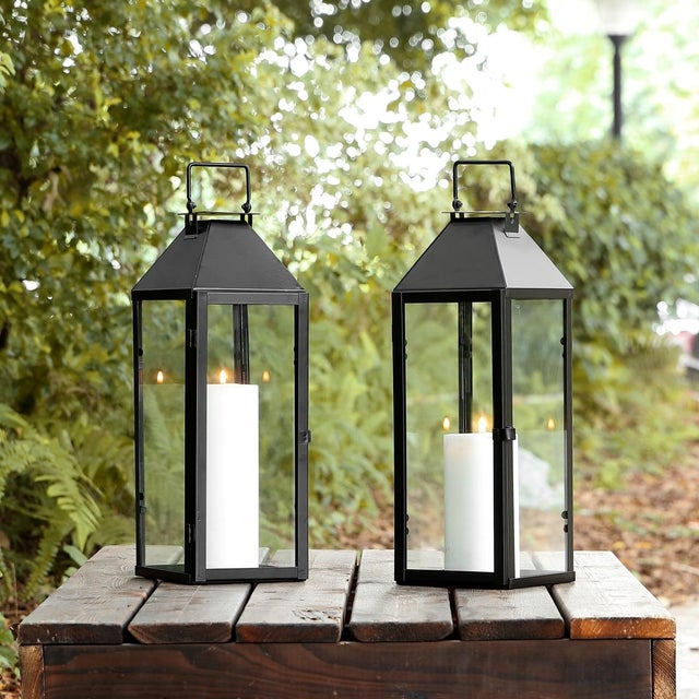 Illuminate your outdoor space with the Ruane outdoor lantern set. Standing at 17.5 inches, these lanterns are crafted from...