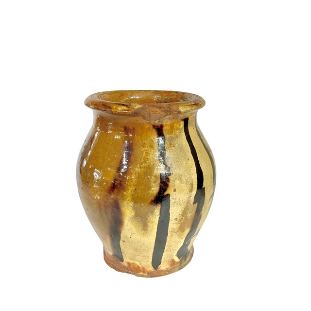 Lovely drippy glaze I shades of dark brown and cream. A traditional vessel for water. Sourced in France.