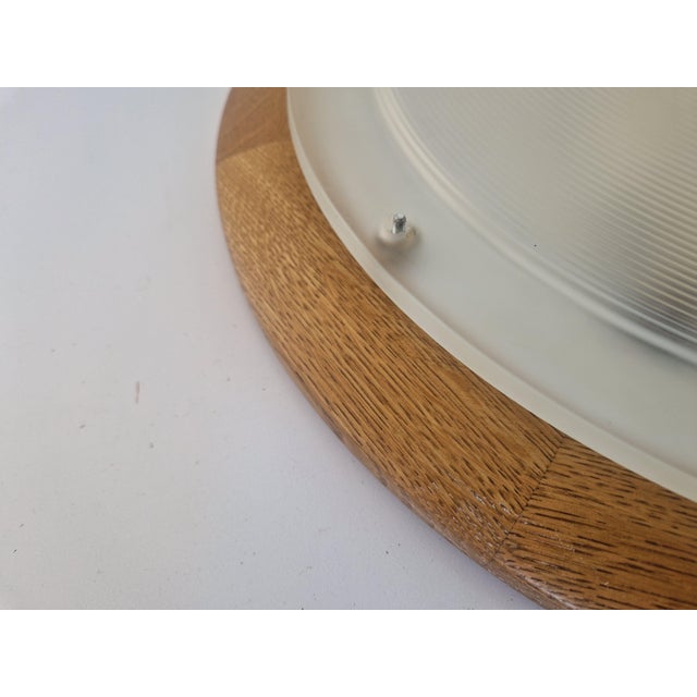 Large Flushmount Lamp in Oak and Glass from Hustadt Leuchten, 1970s, in Very Good conditions. Designed 1970 to 1979 This...