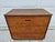 A classic Lane three drawer chest of drawers or dresser with walnut veneers and wooden drawer pulls. The top is laminate....