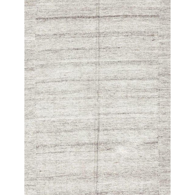A vintage Turkish flat-woven Kilim rug from the mid-20th century. Measures: 5' 11" x 9' 0"