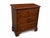 A handsome reproduction 3-drawer mahogany crotch dresser with richly figured drawer fronts, warm reddish-brown finish, and...