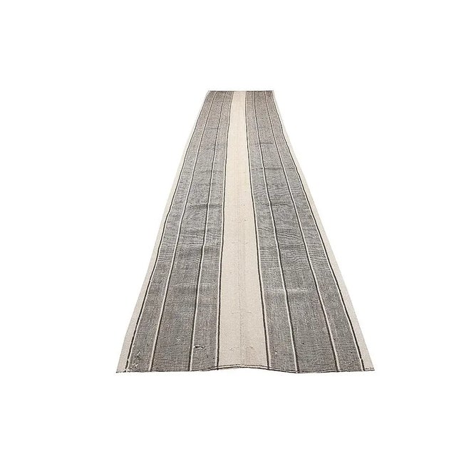 Striped vintage handwoven kilim rug from Adana region of Turkey. Approximately 50-60 years old. In very good condition.