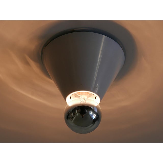 Extremely rare and elegant mid-century modern flush mount / ceiling fixture or sconce. Model jolly. Designed by bruno...