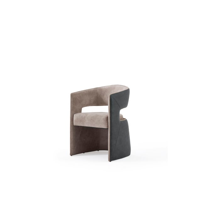 The Lina Dining Chair is a celebration of bold contrast and contemporary luxury. Its dynamic composition pairs rich golden...