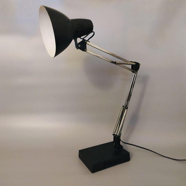 1970s stunning black gorgeous architect table lamp by arteluce in metal with a double-articulated arm and an adjustable...