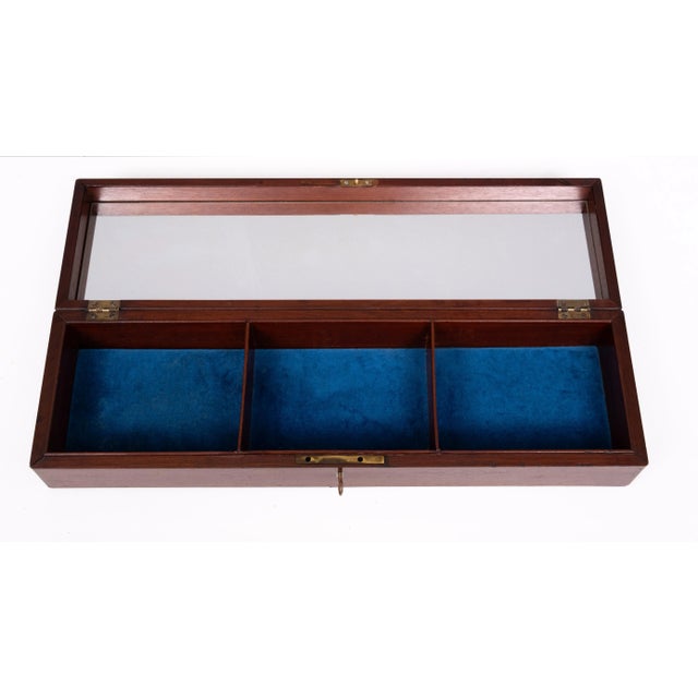 Very nice Antique solid mahogany jewelry box, comes with a Blue Velvet interior and a Mirror in the lid of the box . Ideal...