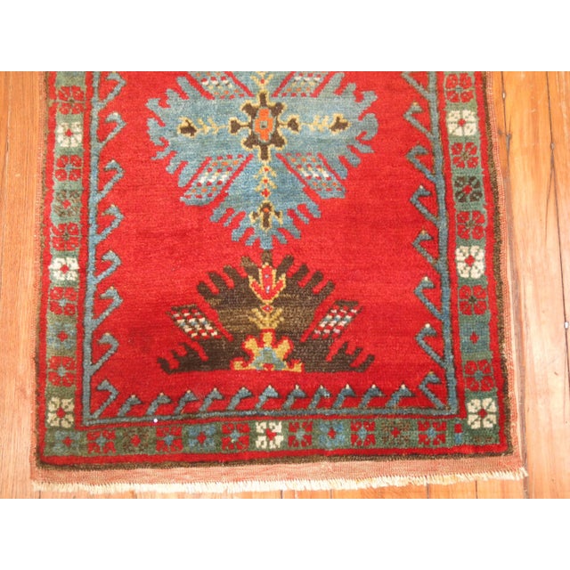Rich colored Antique Turkish Yastik Rug.