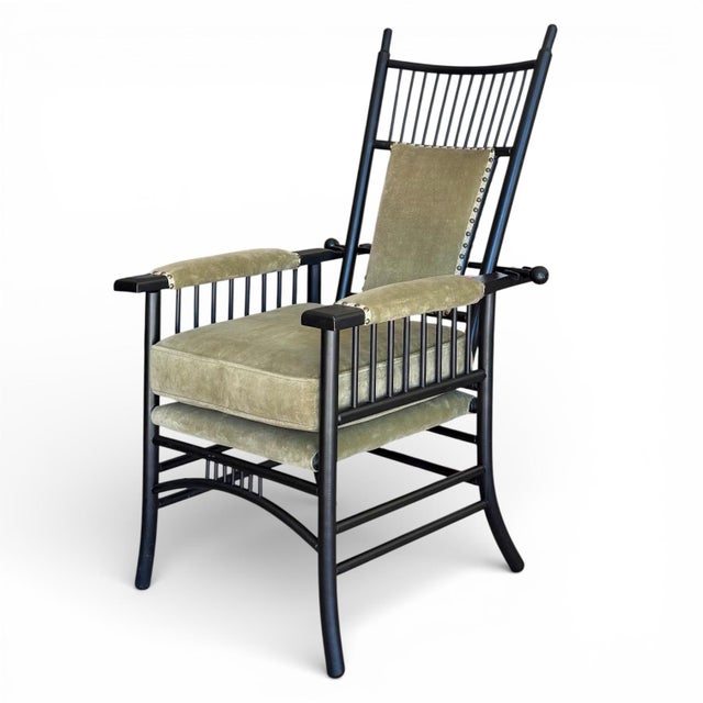 An ebonized oak English Arts and Crafts reclining chair, circa 1900, recently restored and having newer velvet upholstery...