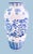 Hand-Painted Blue and White Porcelain Vase Elegant and tall porcelain vase with hand-painted cobalt floral motif on a...