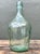 This elegant vintage hand-blown glass demijohn captures the timeless charm of European cellar aesthetics. Featuring a...