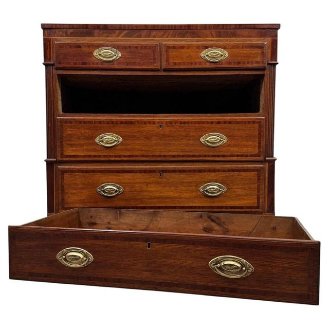 A handsome 18th-century English Georgian chest of drawers, finely crafted from oak and distinguished by its traditional...