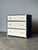 There's a chic quality to vintage campaign dressers that never quite goes out of style — the clean rectilinear case, the...