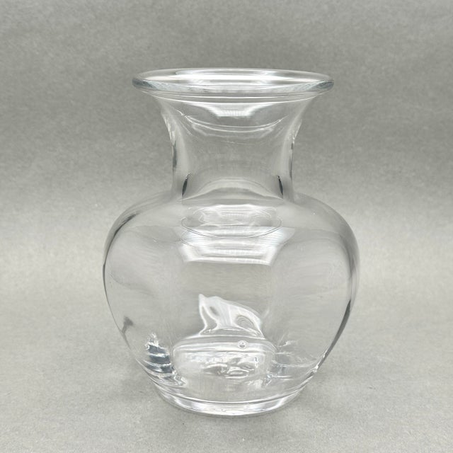 Vintage 1980’s Simon Pearce “Shelburne” glass vase. It is hand blown with a freeform paneled body. It measures...