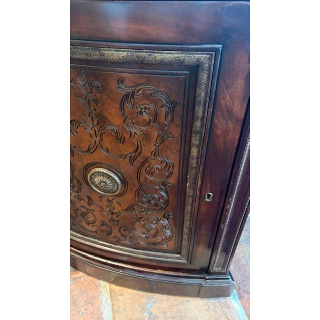 Regency Style Executive Wood Desk Large traditional executive desk featuring a curved form with a rich dark wood finish....