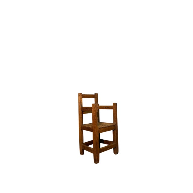 An authentic 19th-century rustic mountain chair, crafted from solid oak. Sturdy and full of character, it features an...
