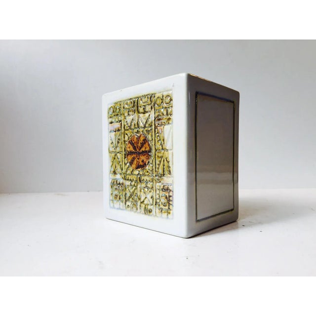 - A cubist faience vase with shimmering glaze in ochre and beige - Tactile surface - Marked with the Aluminia hallmark...
