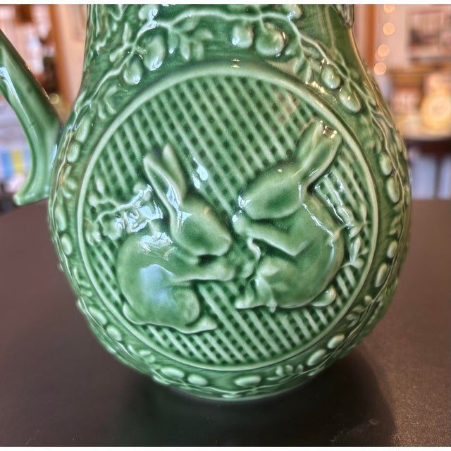 This is a beautiful Bordallo Pinheiro pitcher. This green pitcher features adorable bunnies on each side. The pitcher is...