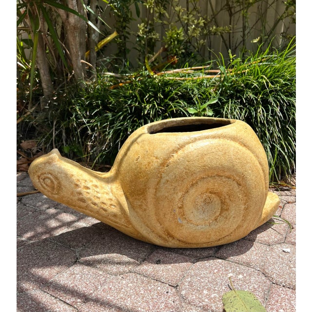 Substantial Terra Cotta Glazed Planter with hole for draining in the shape of a Snail. Planter opening measures 6.5” x 7”
