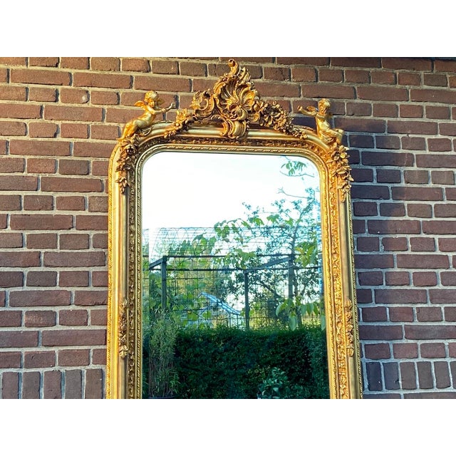 This striking late 20th-century French floor mirror combines full-length functionality with the refined symmetry and...