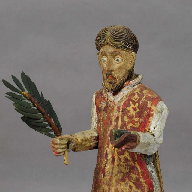 Wooden Carved Sculpture of a Saint ca. 1850 A beautifully hand-carved and hand-painted sculpture of a Saint with palm-...