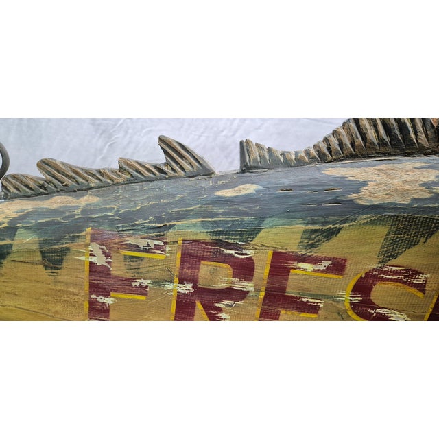 Six foot Atlantic tuna with painted finish. 'Fresh Fish' is painted in red block letters on its right side. Distressed...