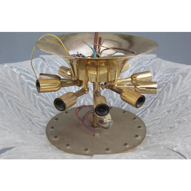 This fantastic Murano Art glass shandelier was produced in the 1970s. When lit, this splendid chandelier is very chic and...